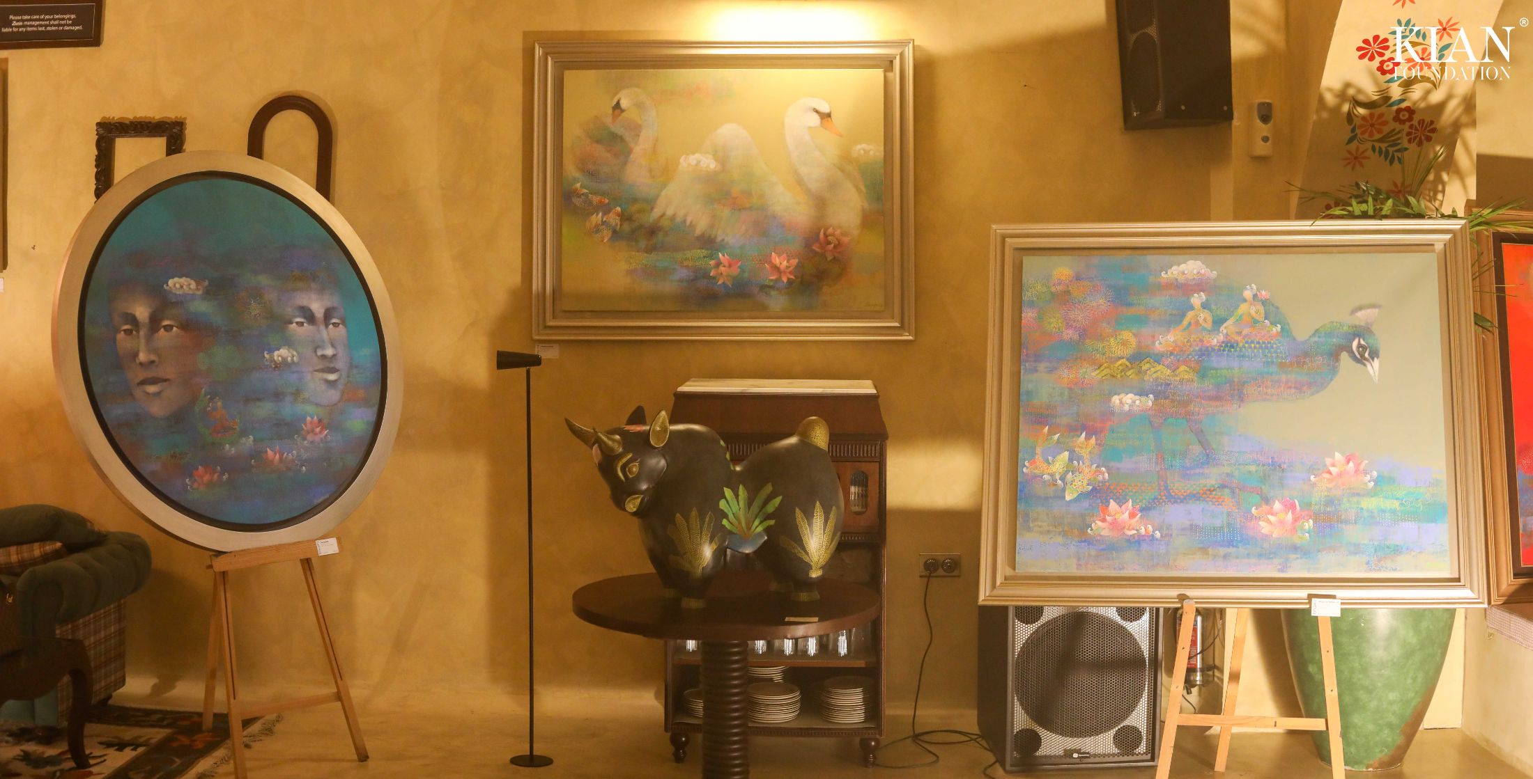 Paintings and the bronze bull at Lucia Lounge