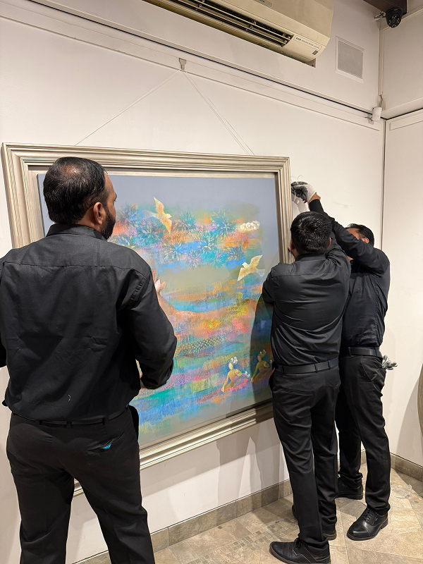 Team hanging Bhūmi artwork