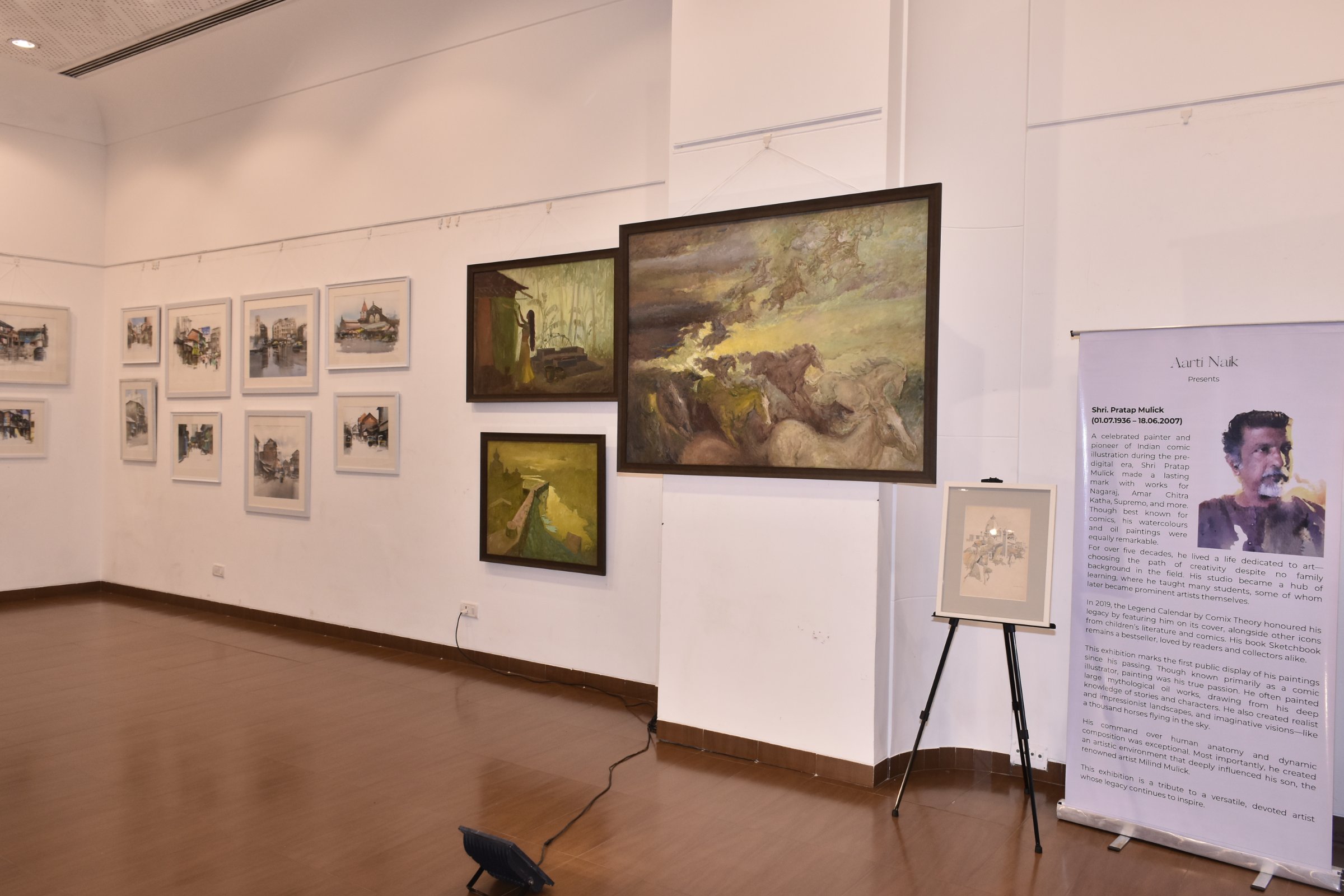 The Pratap Mulick wall - four oils with Horses Fantasy at centre, easel sketch and standee alongside