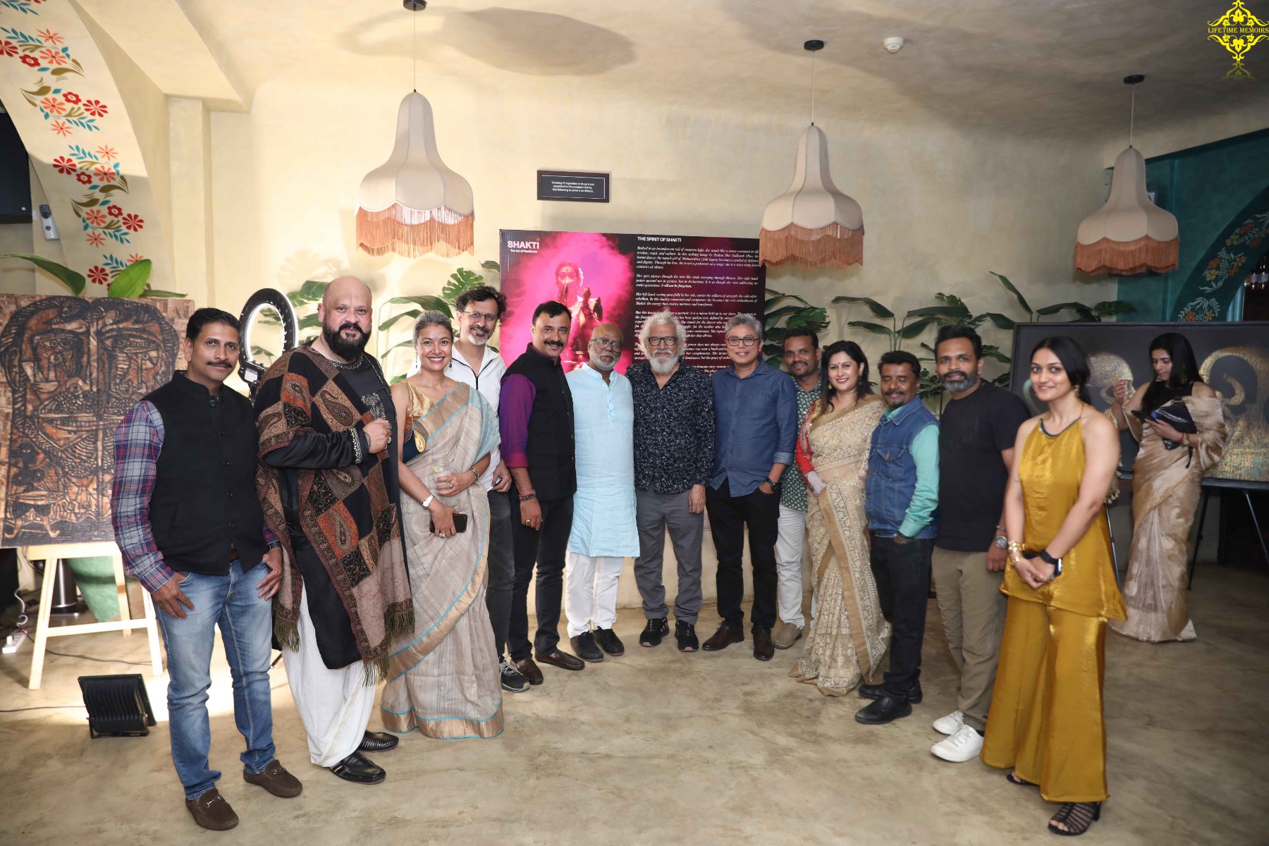 The participating artists gathered before the Shakti standee