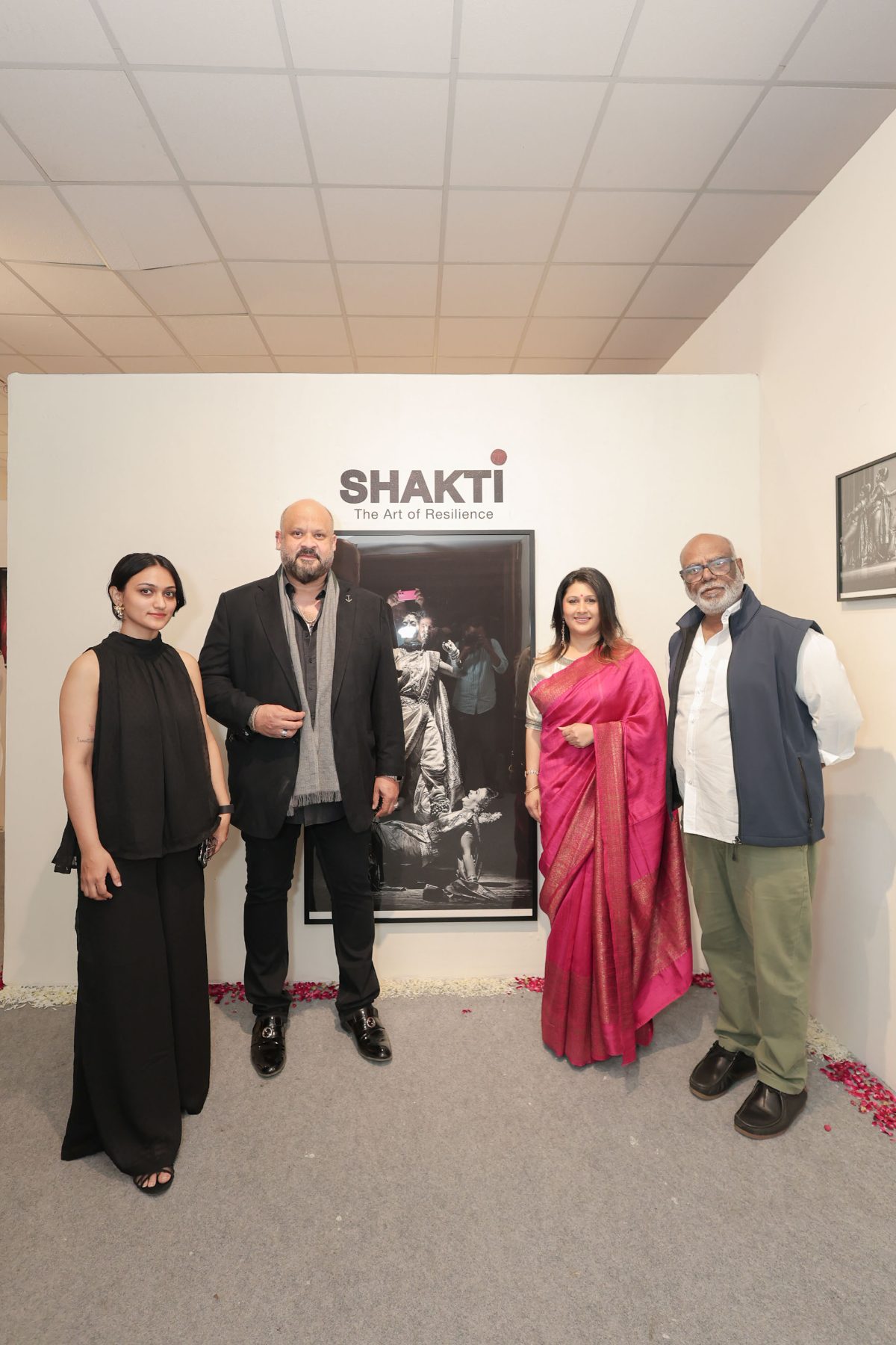 Hosts and guests before the SHAKTI wall and a Lavani portrait